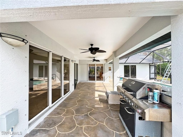 view of patio with glass enclosure, grilling area, and a ceiling fan