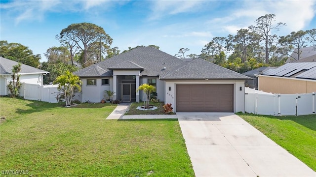 view of front facade featuring a garage, fence, driveway, a gate, and a front lawn