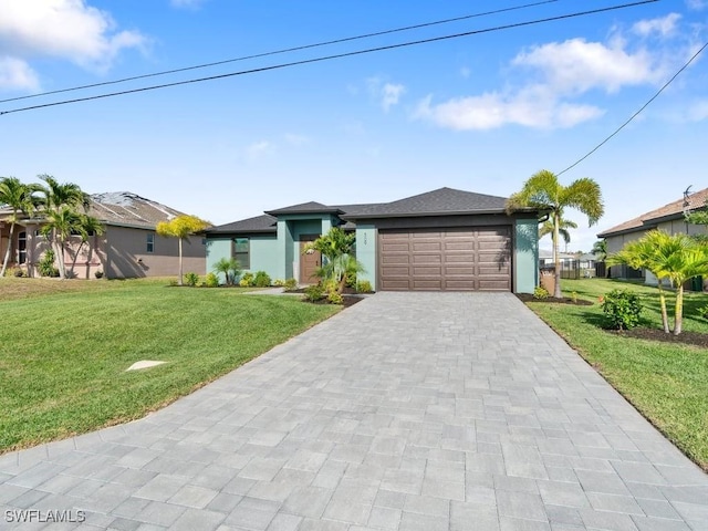 view of front of home featuring an attached garage, stucco siding, decorative driveway, and a front yard