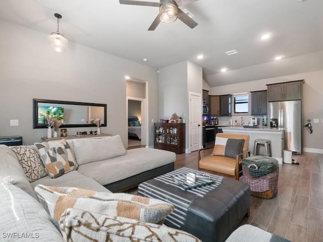 509 SW 8th Ct, Cape Coral, FL 33991 - living area featuring a ceiling fan, light wood-style floors, vaulted ceiling, and recessed lighting