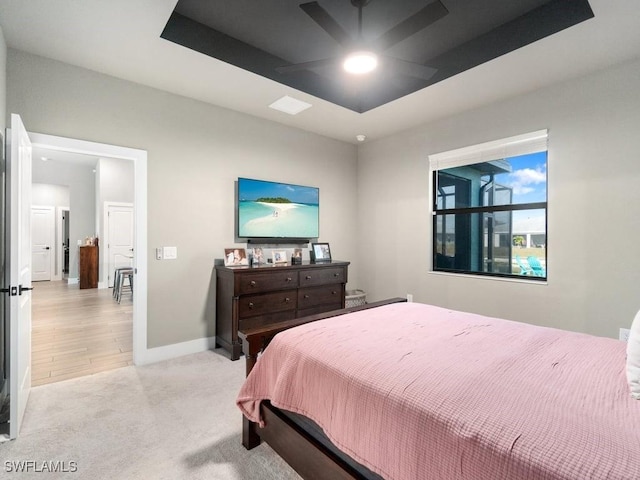 509 SW 8th Ct, Cape Coral, FL 33991 - bedroom with light carpet, baseboards, and a raised ceiling