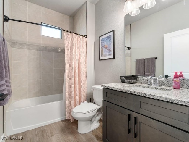 509 SW 8th Ct, Cape Coral, FL 33991 - full bath with wood finished floors, toilet, shower / bath combo, vanity, and a textured wall