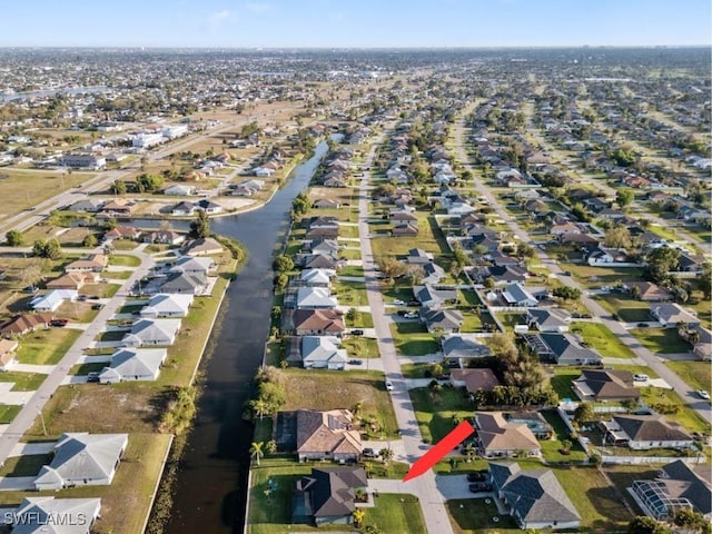 509 SW 8th Ct, Cape Coral, FL 33991 - aerial view of property and surrounding area with nearby suburban area and a nearby body of water