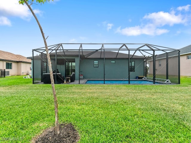 509 SW 8th Ct, Cape Coral, FL 33991 - rear view of house featuring a lawn, an outdoor pool, a lanai, and a patio area