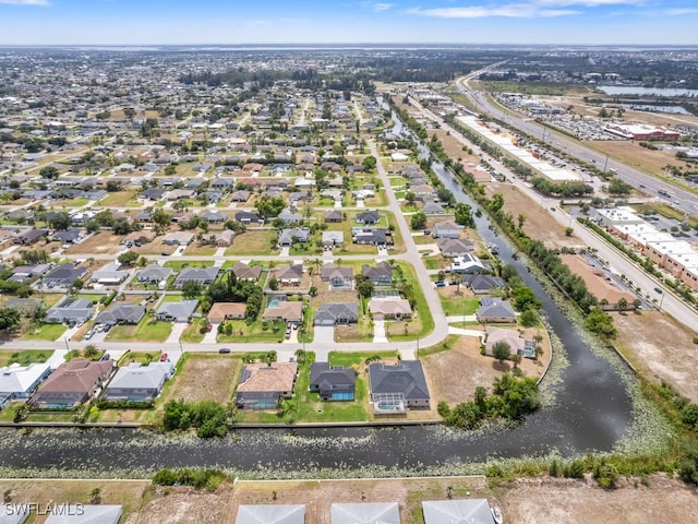 509 SW 8th Ct, Cape Coral, FL 33991 - aerial perspective of suburban area featuring a nearby body of water