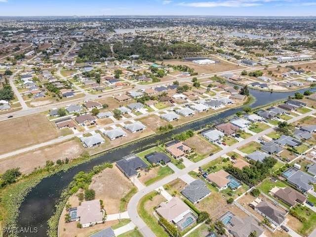 509 SW 8th Ct, Cape Coral, FL 33991 - aerial overview of property's location with a large body of water and nearby suburban area