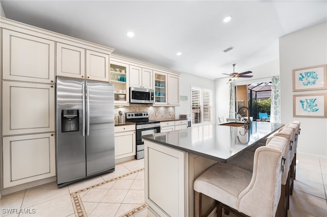 kitchen with light tile patterned floors, tasteful backsplash, visible vents, appliances with stainless steel finishes, and recessed lighting