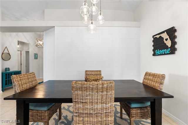 dining area featuring baseboards and light tile patterned floors