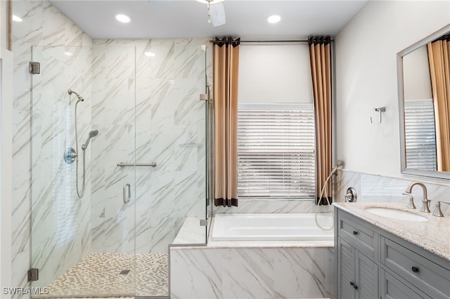 bathroom featuring a garden tub, a marble finish shower, vanity, and recessed lighting