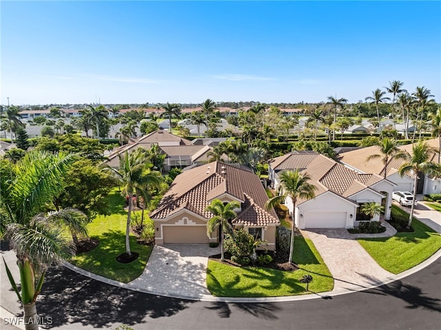 birds eye view of property with a residential view