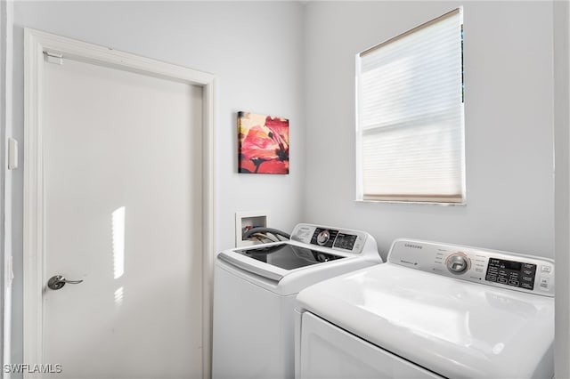 clothes washing area featuring laundry area and washer and dryer