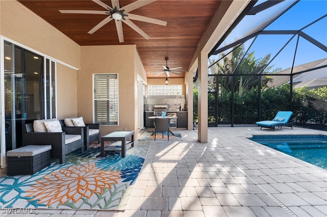 view of patio with an outdoor pool, a ceiling fan, an outdoor hangout area, a lanai, and exterior kitchen