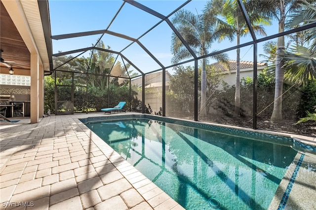 pool featuring a lanai and a patio area