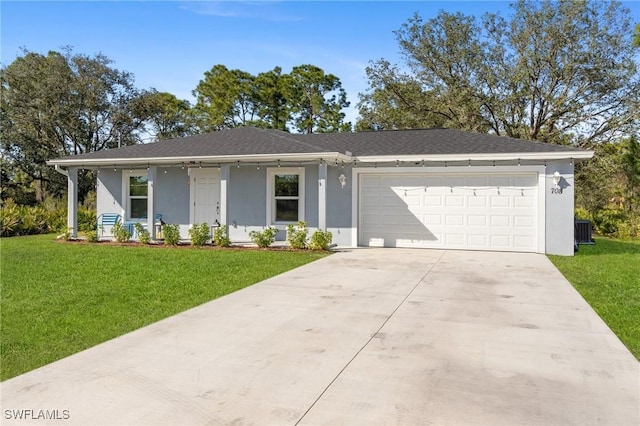 single story home with a garage, a front yard, concrete driveway, and stucco siding