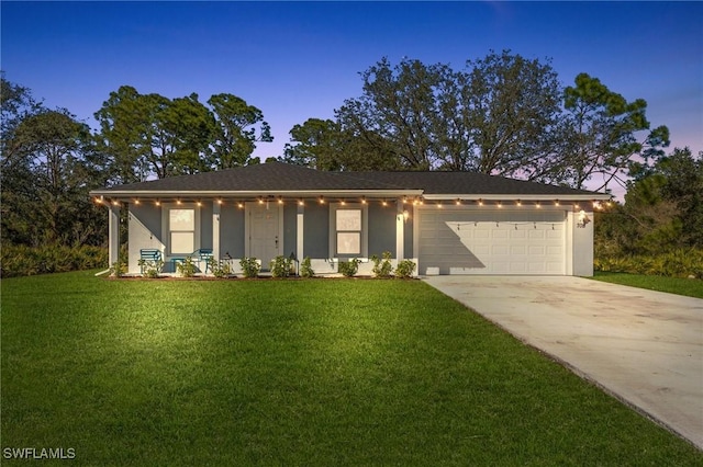 ranch-style house featuring concrete driveway, a front lawn, and stucco siding