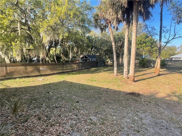 view of yard with a fenced backyard