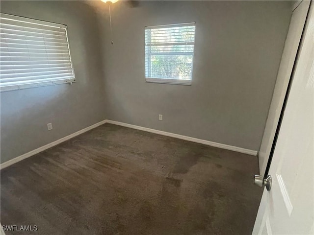 unfurnished bedroom with carpet floors and baseboards