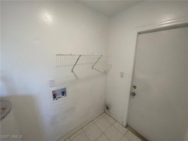 washroom featuring laundry area, light tile patterned flooring, and hookup for a washing machine