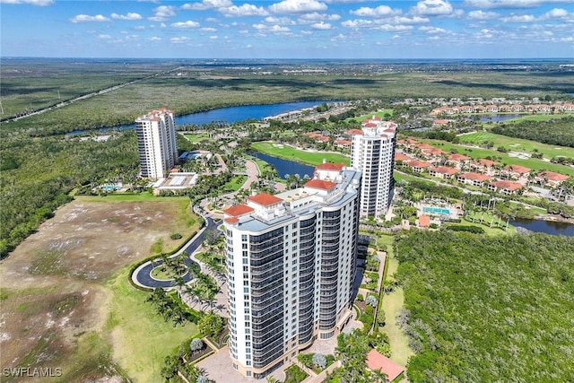 birds eye view of property featuring a water view and a city view