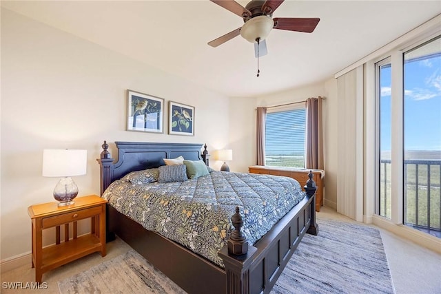 bedroom with light carpet, multiple windows, baseboards, and access to exterior