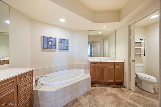 full bath featuring recessed lighting, vanity, toilet, and a bath