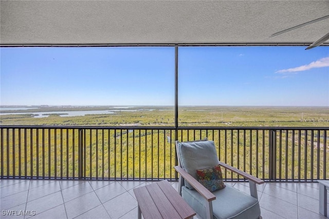 unfurnished sunroom featuring a rural view