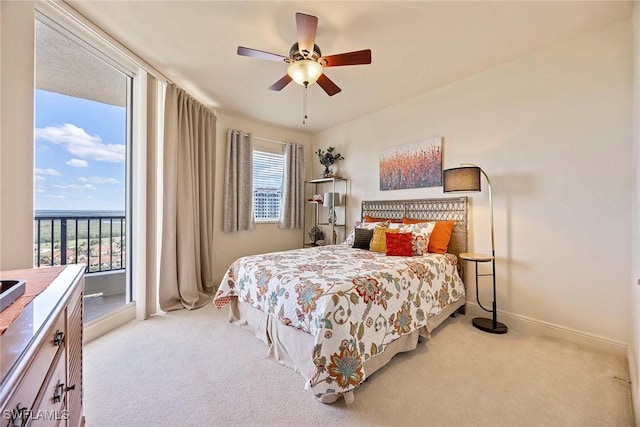 carpeted bedroom with a ceiling fan, access to outside, and baseboards