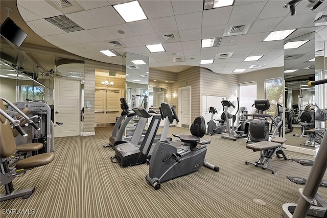 exercise room featuring carpet and visible vents