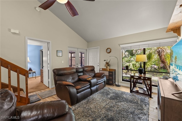 living room with baseboards, french doors, high vaulted ceiling, and a ceiling fan