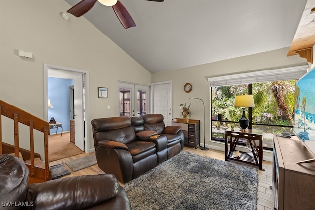 1861 Crystal Dr Unit 16, Fort Myers, FL 33907 - living room featuring high vaulted ceiling, french doors, stairs, and ceiling fan