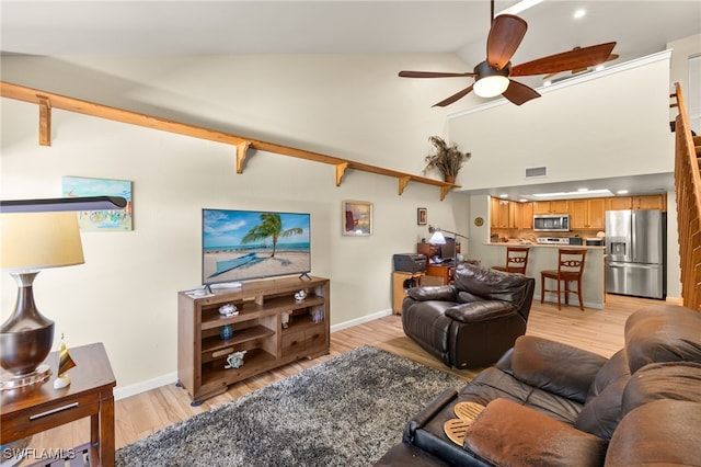 1861 Crystal Dr Unit 16, Fort Myers, FL 33907 - living room with a ceiling fan, light wood-type flooring, baseboards, high vaulted ceiling, and recessed lighting