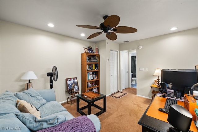 living room featuring light colored carpet, ceiling fan, recessed lighting, and baseboards