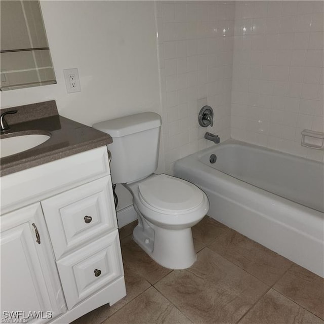 bathroom with  shower combination, tile patterned flooring, vanity, and toilet