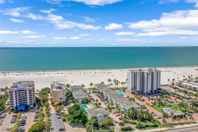 aerial view featuring a water view and a beach view