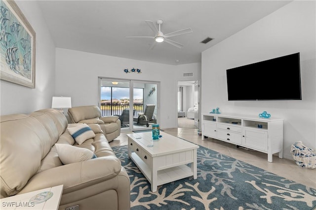 tiled living room with a ceiling fan and visible vents