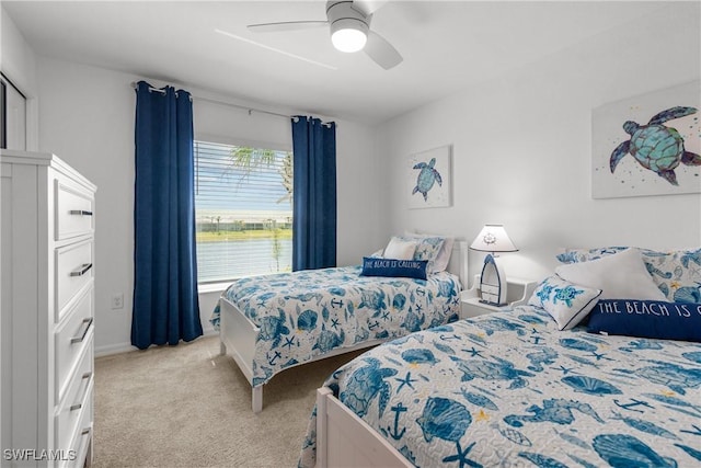 bedroom with light carpet and ceiling fan