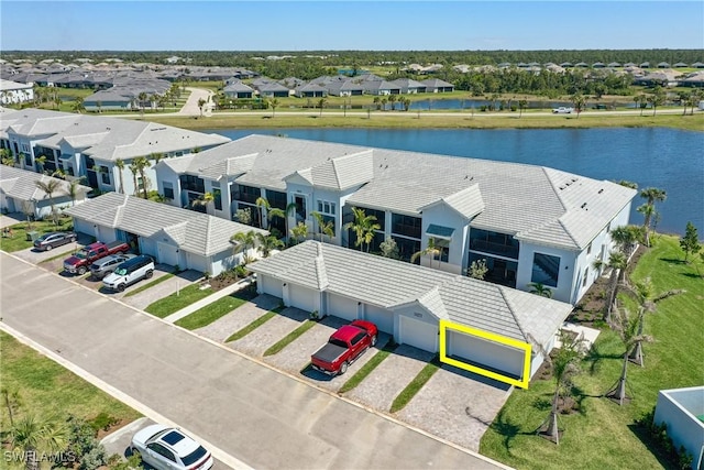 birds eye view of property with a residential view and a water view