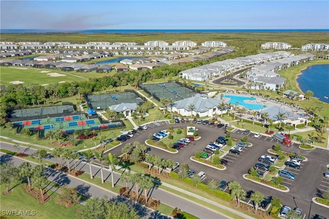 birds eye view of property featuring a residential view and a water view