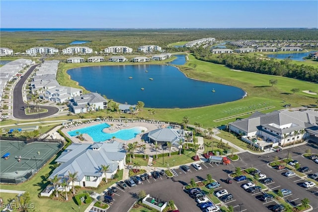 birds eye view of property with a water view