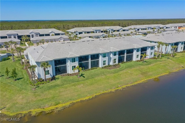 birds eye view of property with a residential view and a water view