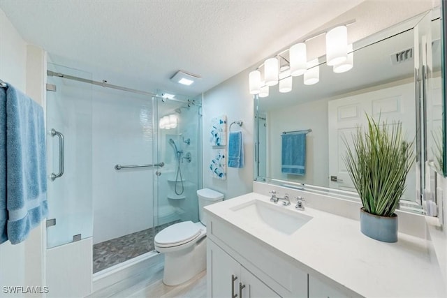 full bath featuring a stall shower, visible vents, a textured ceiling, and toilet