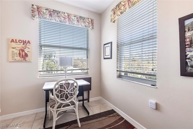 home office featuring light tile patterned floors and baseboards