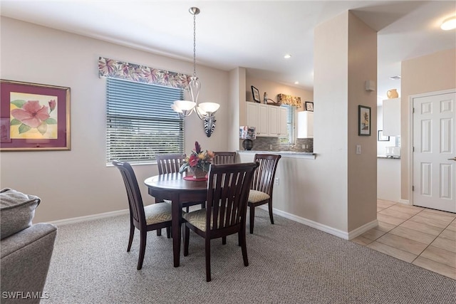 dining space featuring recessed lighting, a chandelier, baseboards, and light tile patterned flooring