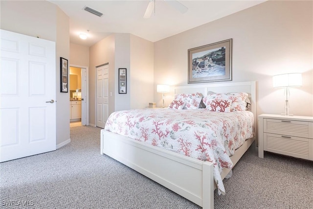 carpeted bedroom featuring baseboards, visible vents, a closet, and ceiling fan