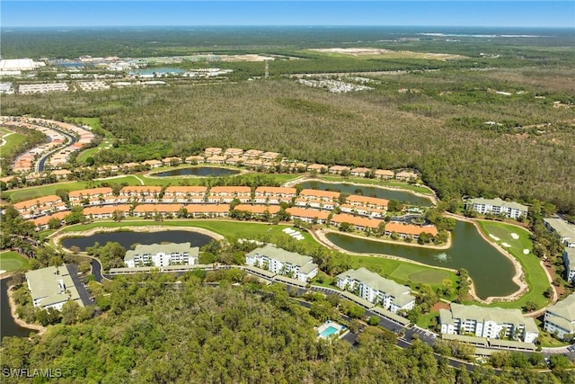 birds eye view of property featuring view of golf course and a water view