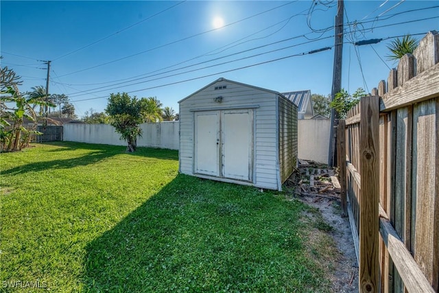 view of shed with a fenced backyard