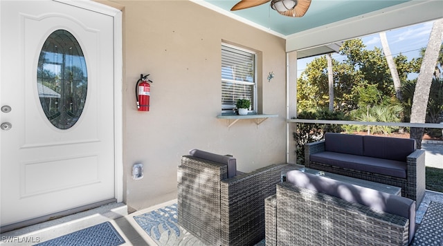 exterior space with a ceiling fan, an outdoor hangout area, and stucco siding