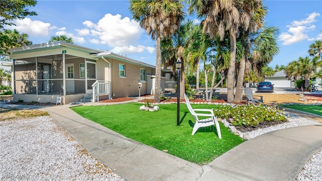 view of yard with a sunroom