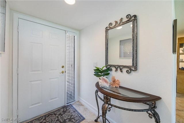 foyer entrance with baseboards