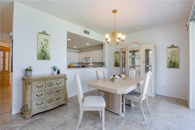 dining space featuring recessed lighting, visible vents, baseboards, and an inviting chandelier